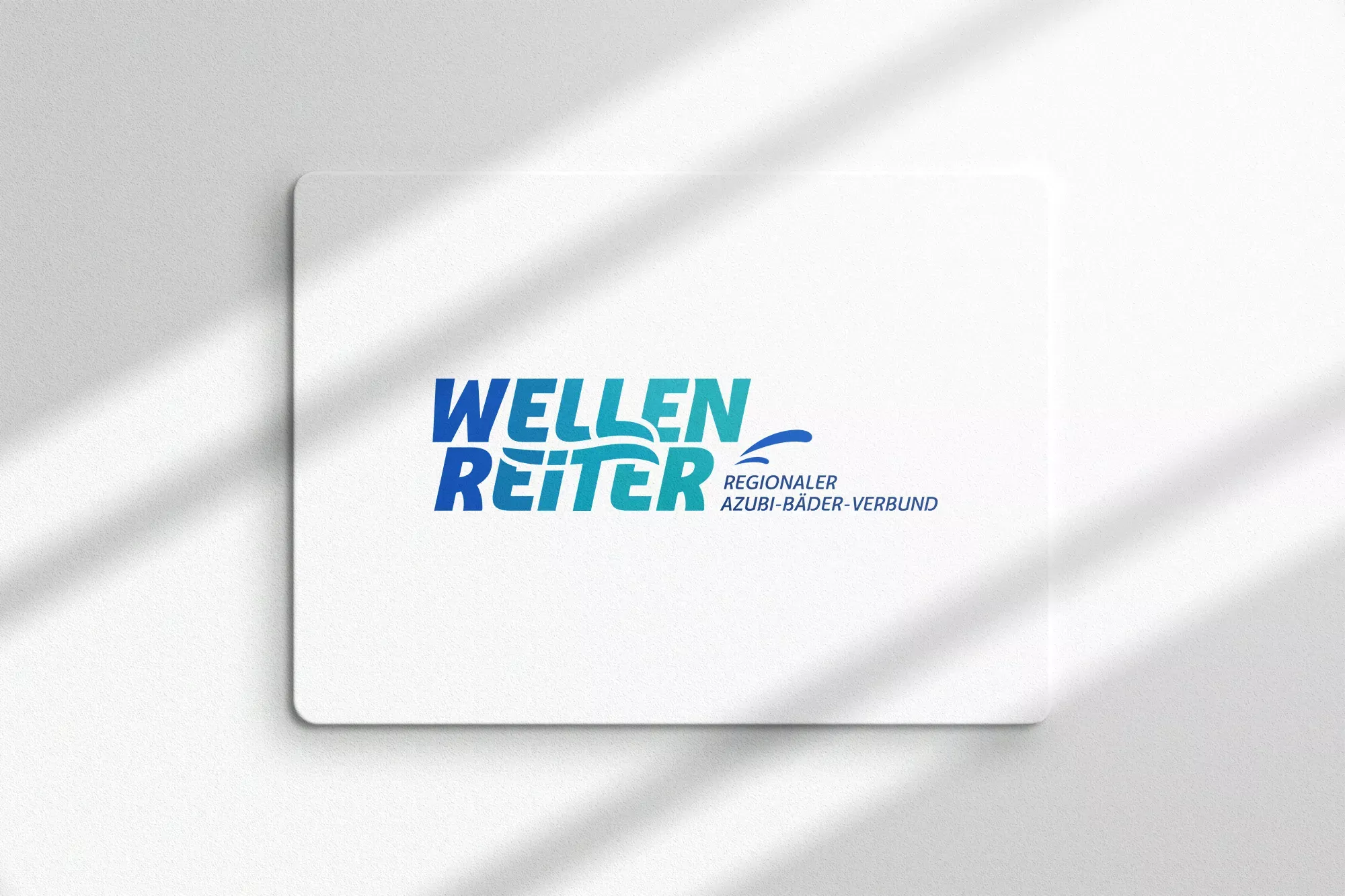 Das Logo des Bäderverbundes Wellenreiter ist auf ein weißes Blatt gedruckt.